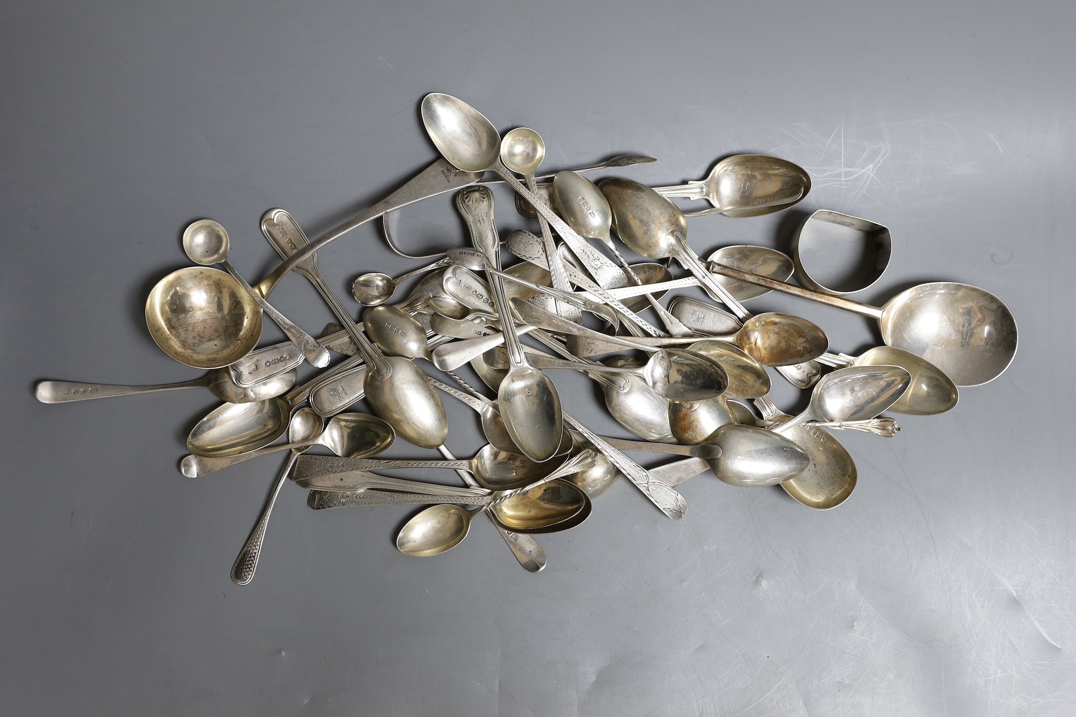 A quantity of mainly 19th century silver teaspoons, various dates and makers and other items including a George III seal top soon, a George IV sauce ladle and a silver napkin ring